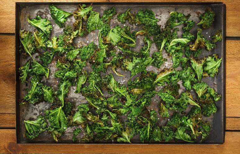 Spread kale on a baking sheet and season to taste.